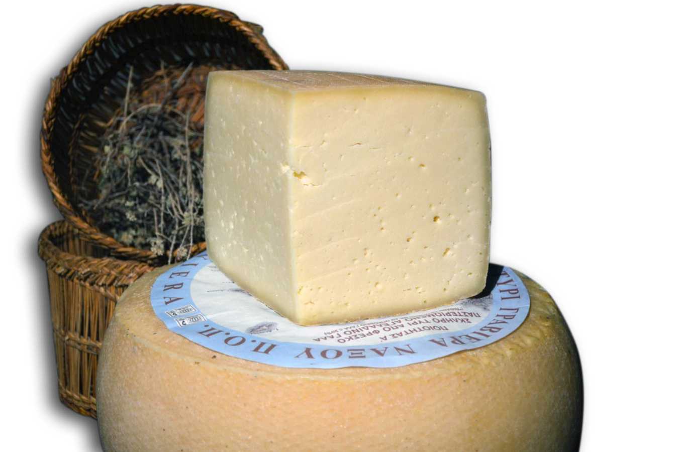 The traditional Cheese in the Cyclades laying on a round table with their traditional baskets at the back