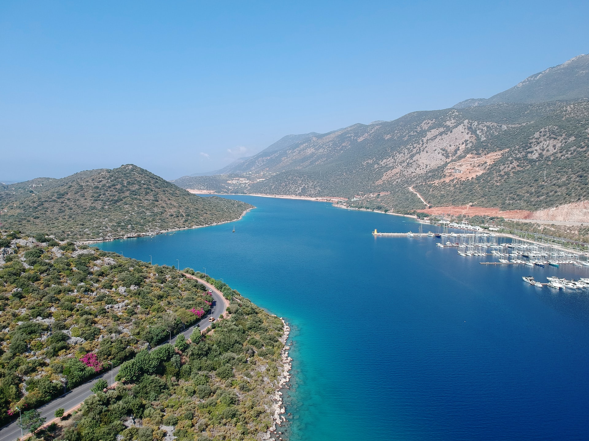 An Aerial view of green mountains and blue sea view of Dreamy Kas beache
