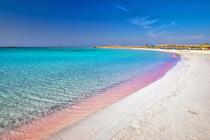 Pic of a beach with pink and blue water - September best beaches