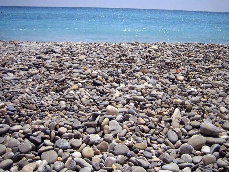 Nice's Pebble Beach, which has a lot of pebble rocks along the sea