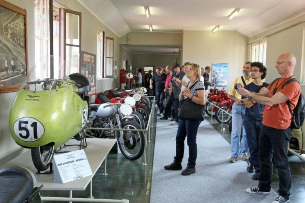 People Looking At Motorcycles At Museum Moto Guzzi