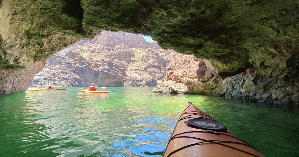 Emerald Cave with some tourists kayaking
