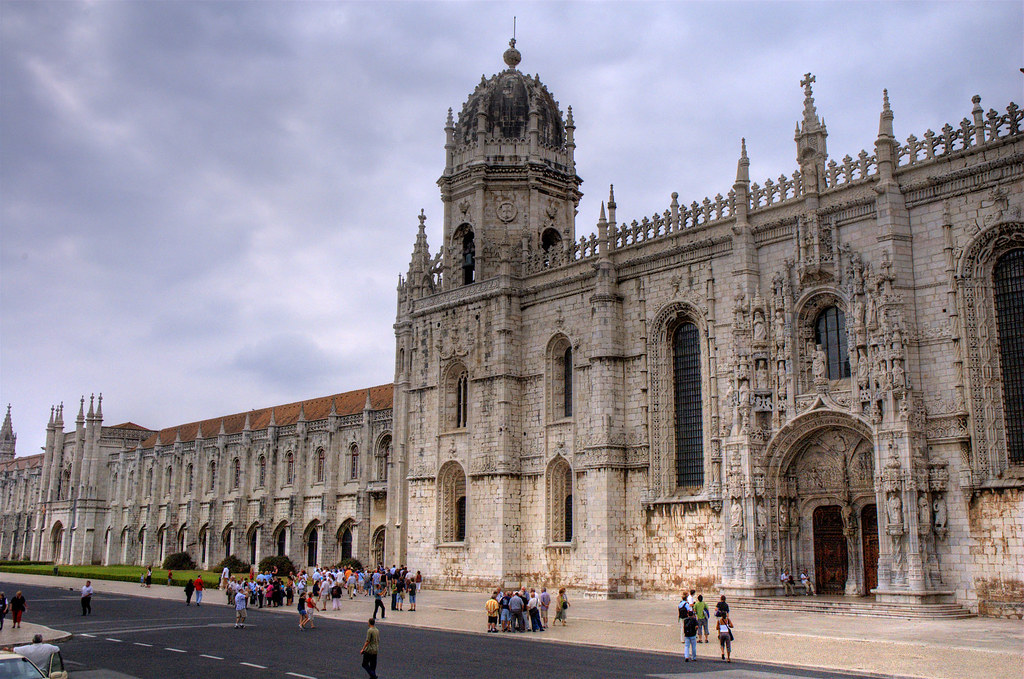 Jerónimos Monastery with some tourists near the architecture