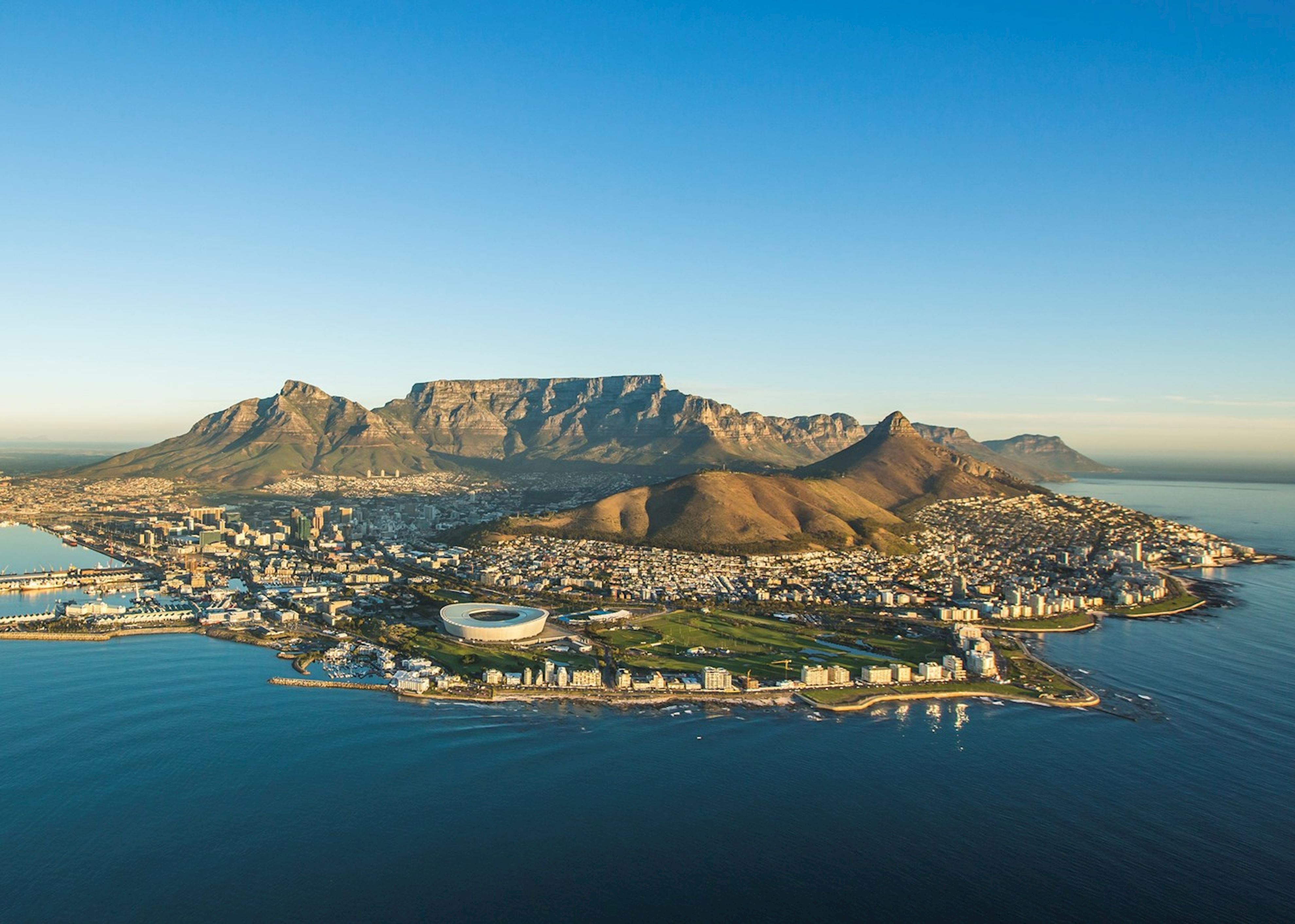 An aerial view of Cape Town with mountains in the backdrop