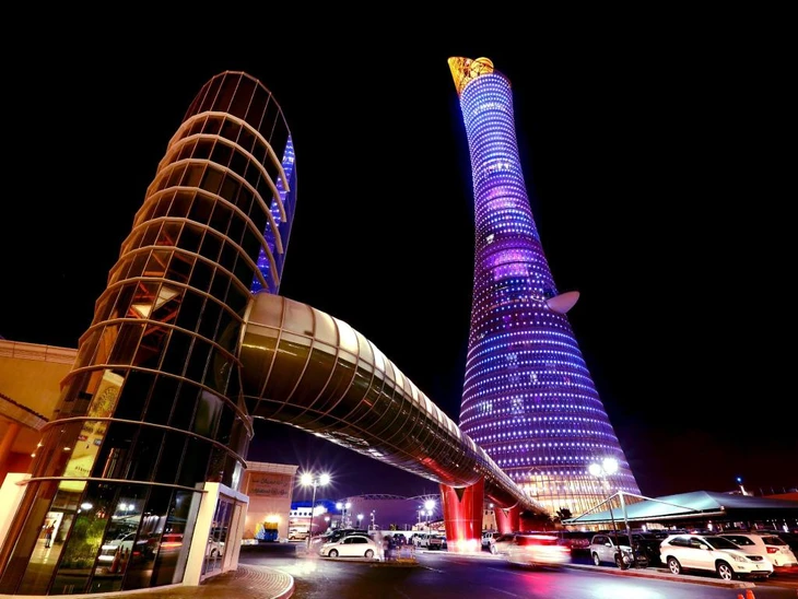 The Torch Doha Hotel In Purple Lights During Evening Time