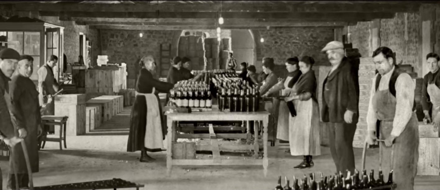 An old photo of people working in a winery