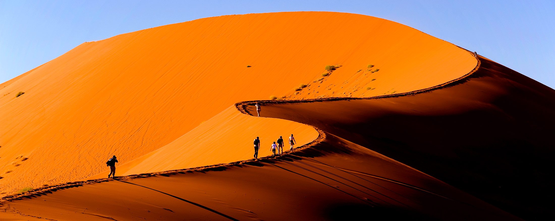 Tourists experiencing the dunes of Sossusvlei