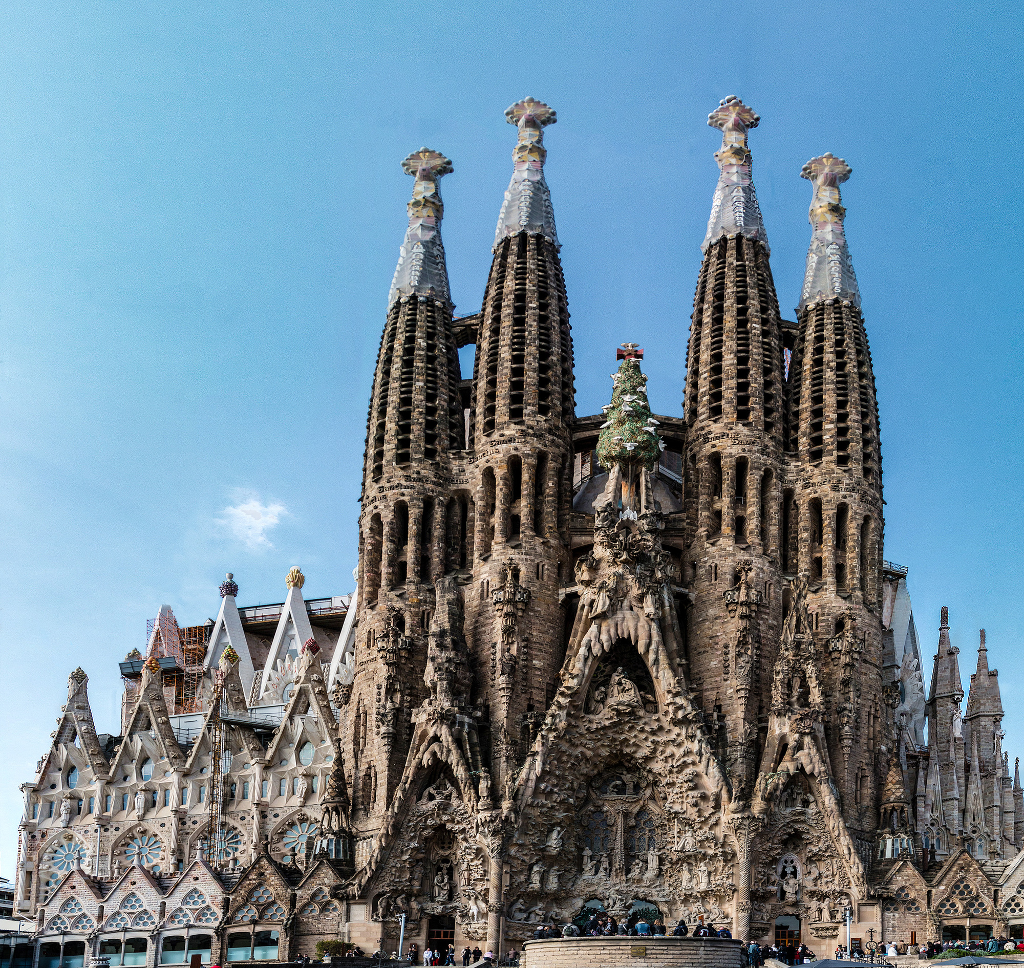 Tourists flock at the entrance of Sagrada Familia
