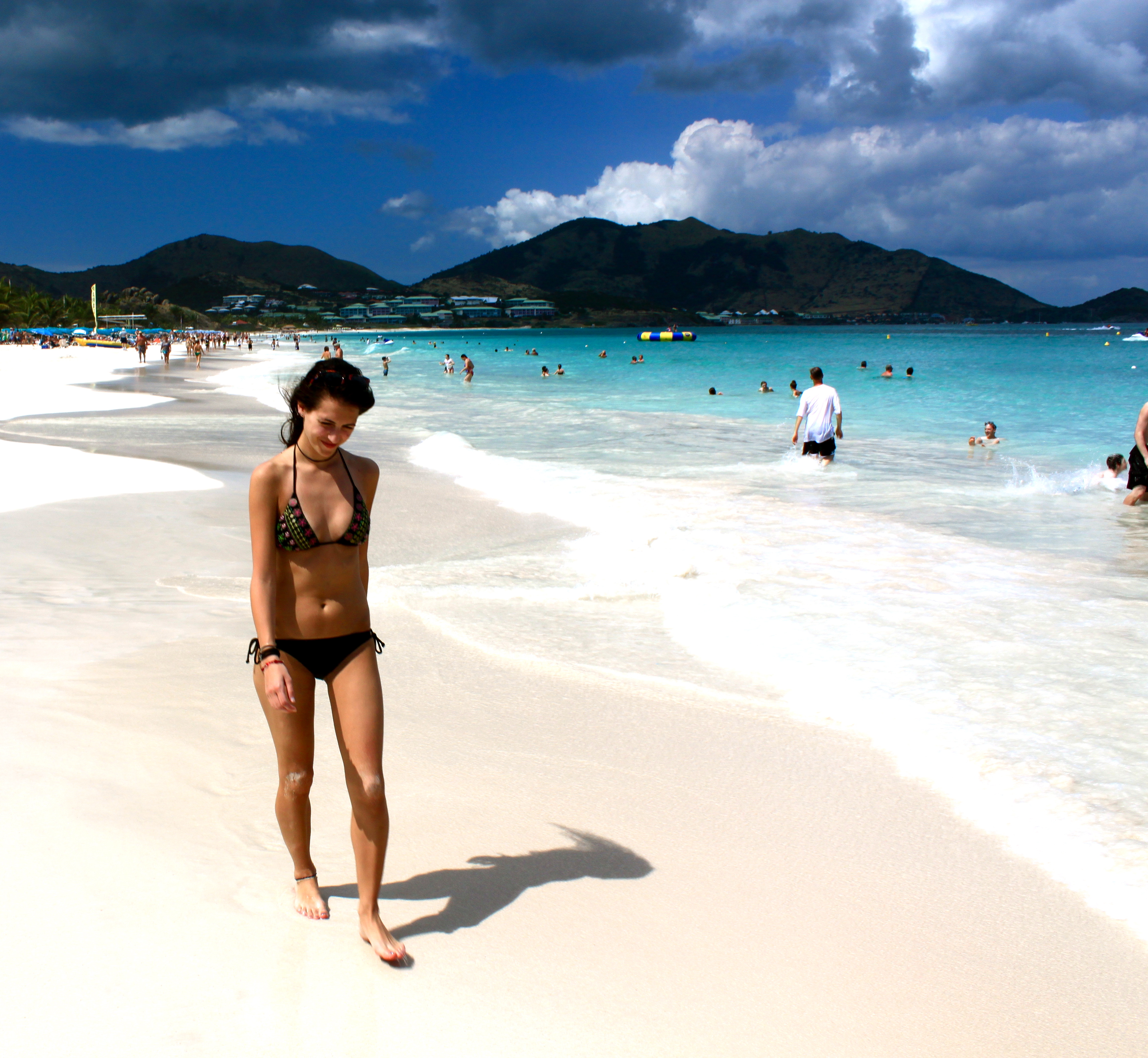 A woman walking at the beach side in Caribbean