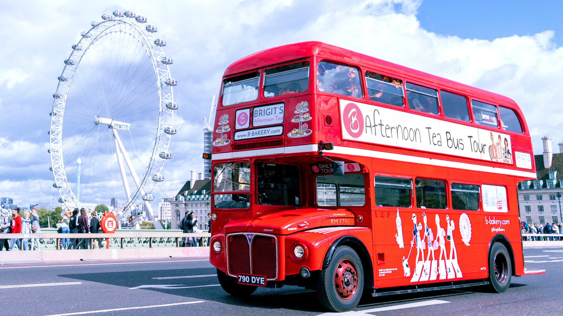 The red double decker London bus on the road