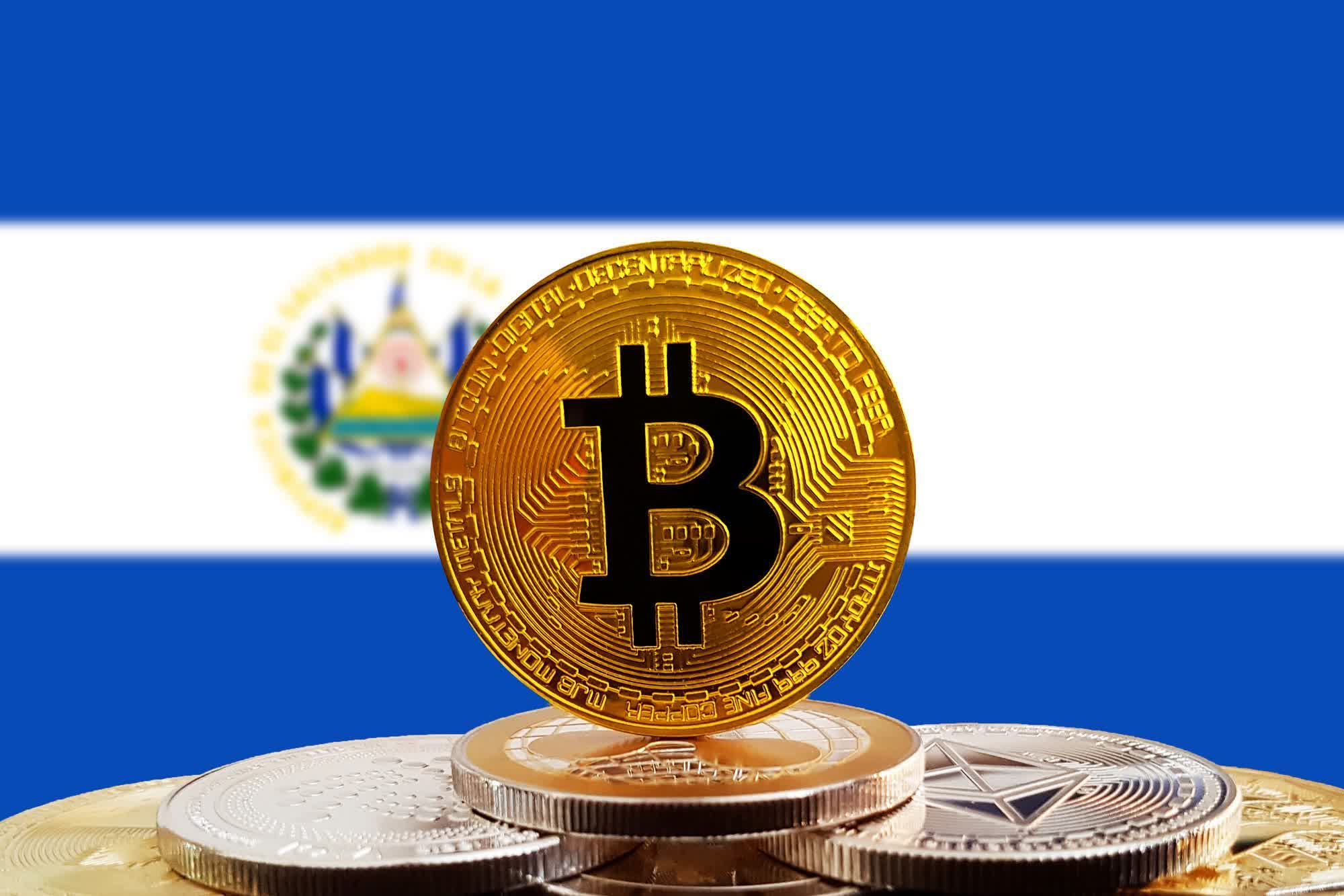 Bitcoins with the flag of El Salvador behind