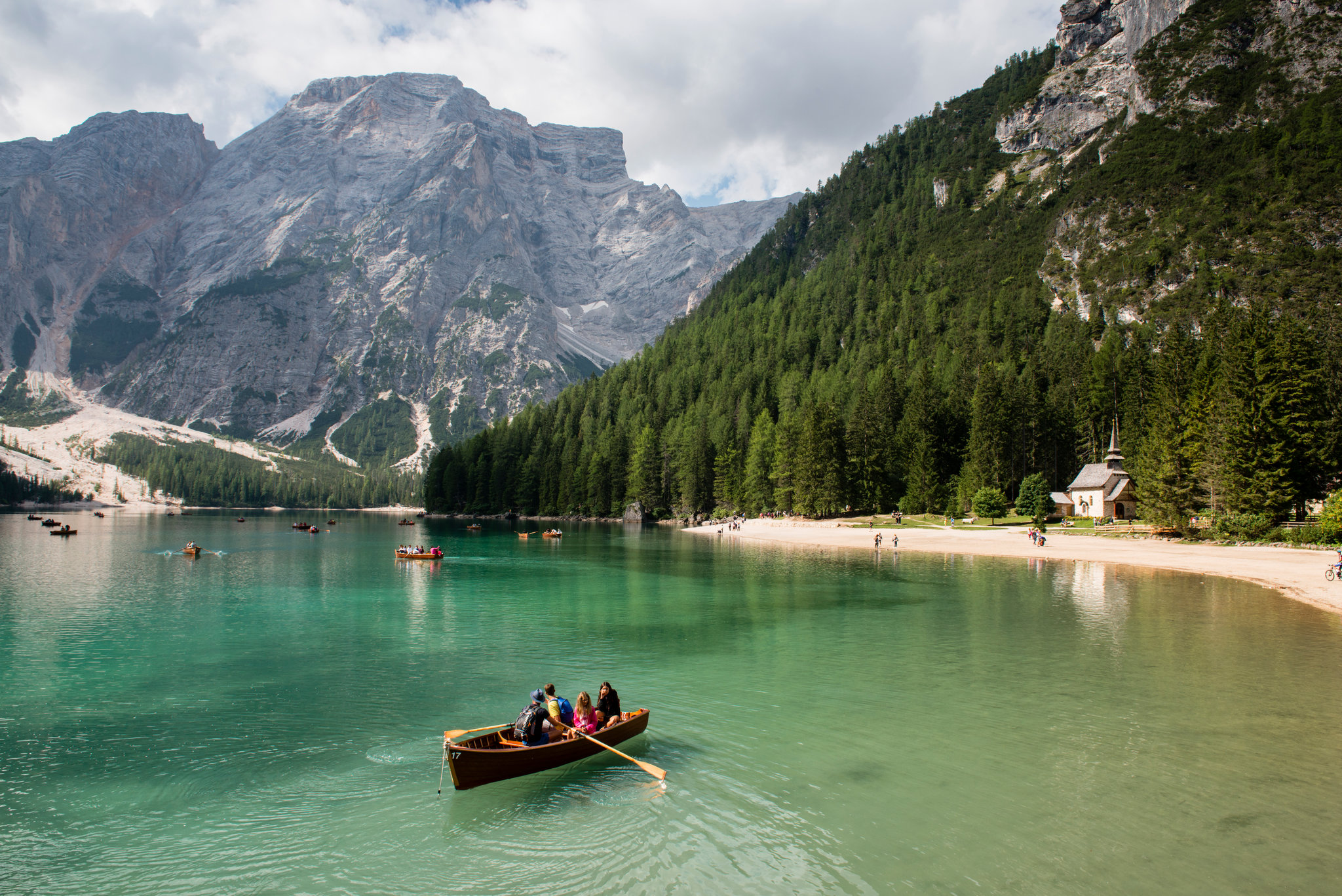 Tourists on the lake in Dolomite area in Northern Italy