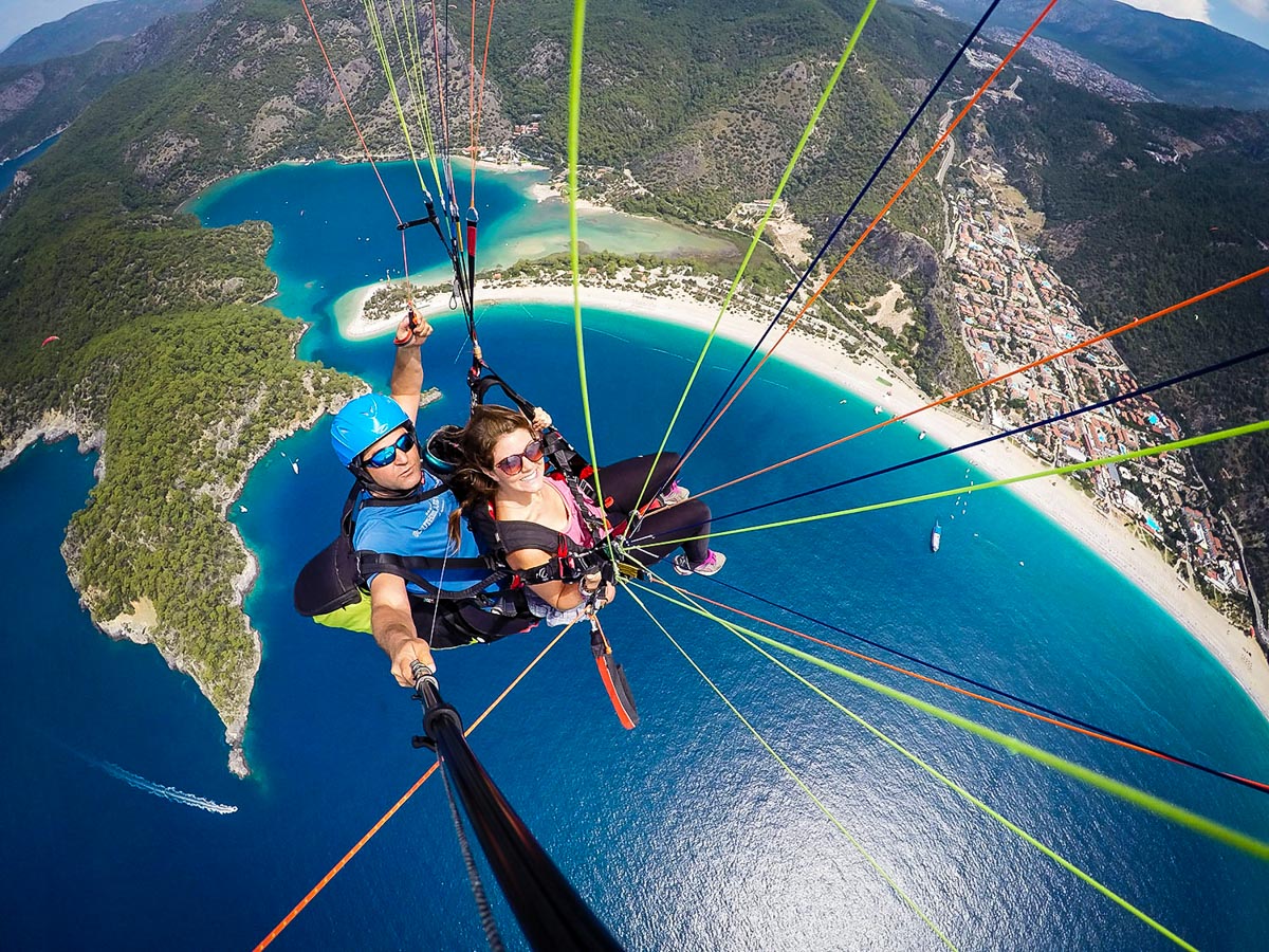A man and a woman windsurfing in Turkey