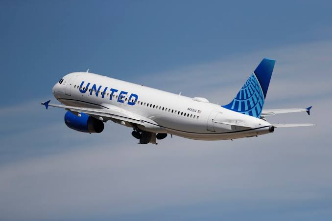 A United Airlines plane flying in the sky
